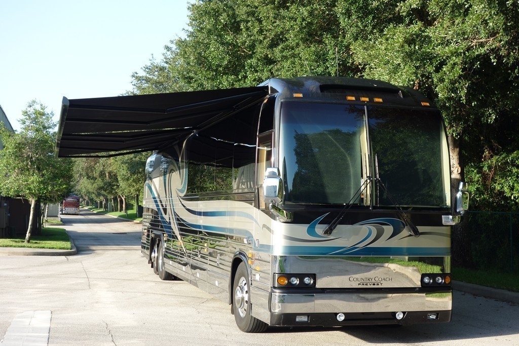 0001 Prevost XLII Country Coach Awnings - after new awnings and headlight upgrade by Excalibur Coach.jpg